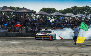 Unknown rider on the car brand Nissan  makes a mistake on the tr