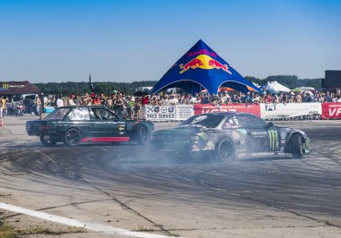 Unknown riders  on the cars  brand  BMW and Nissan overcomes the