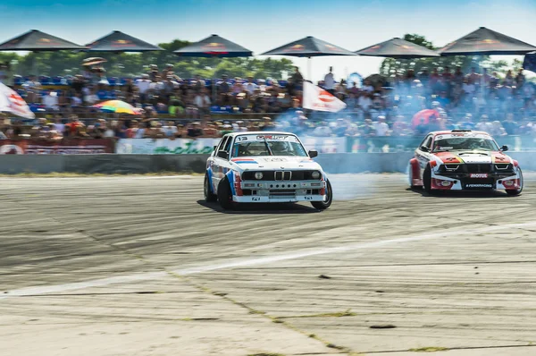 Unknown riders  on the cars  brand  BMW  overcomes the track — Stock Photo, Image