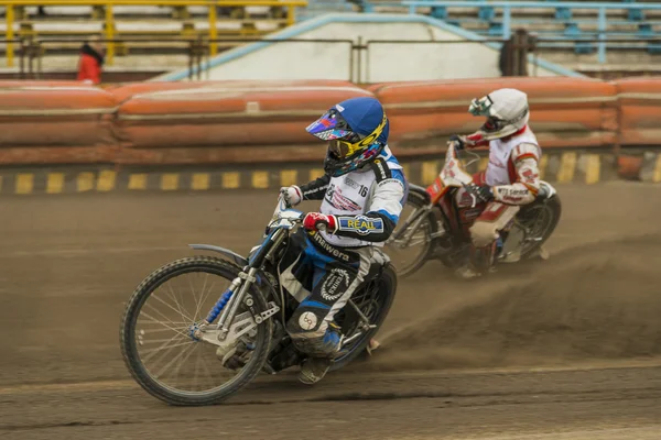 Unknown riders overcomes the track — Stock Photo, Image