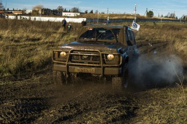 Unknown rider on the off-road vehicle overcomes a route clipart