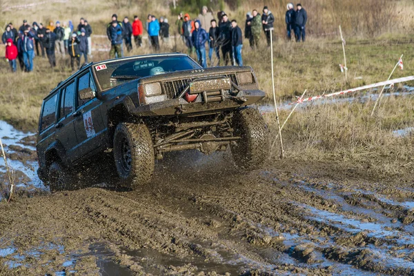 Unknown rider on the off-road vehicle overcomes a route