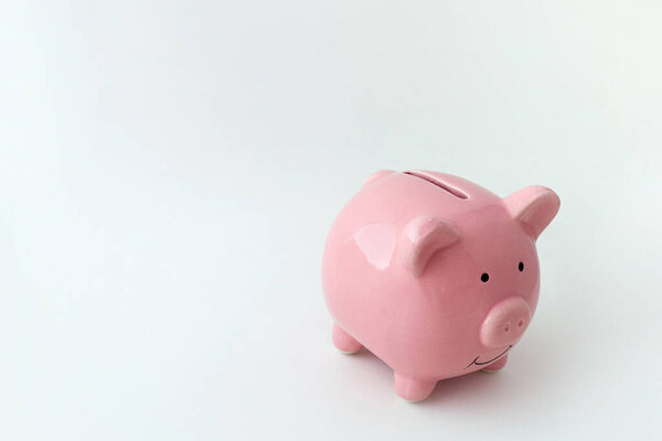 Piggy bank in the shape of a pig on an isolated white background