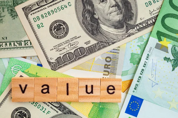 Value Inscription Wooden Cubes Texture Dollars Euro Banknotes — Stock Photo, Image