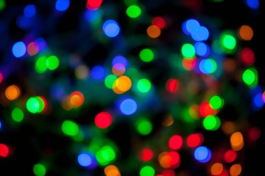 Çok renkli Noel ve yeni yıl ışıklarının bokeh dokusu