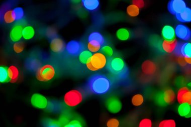 Çok renkli Noel ve yeni yıl ışıklarının bokeh dokusu