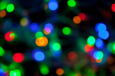 Çok renkli Noel ve yeni yıl ışıklarının bokeh dokusu