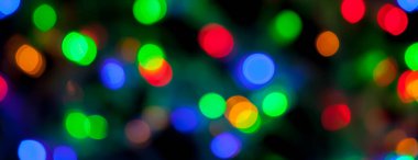 çok renkli Noel ve yeni yıl ışıklarının panorama bokeh dokusu