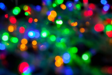 Çok renkli Noel ve yeni yıl ışıklarının bokeh dokusu
