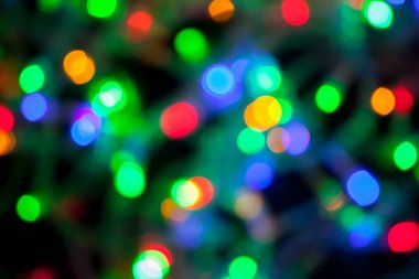 Çok renkli Noel ve yeni yıl ışıklarının bokeh dokusu