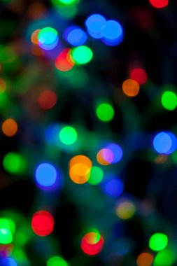 Çok renkli Noel ve yeni yıl ışıklarının bokeh dokusu