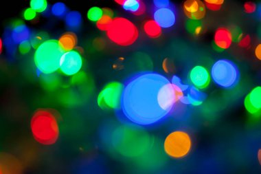 Çok renkli Noel ve yeni yıl ışıklarının bokeh dokusu