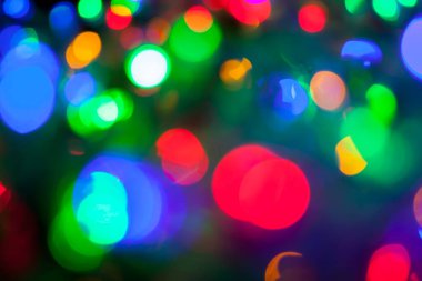 Çok renkli Noel ve yeni yıl ışıklarının bokeh dokusu