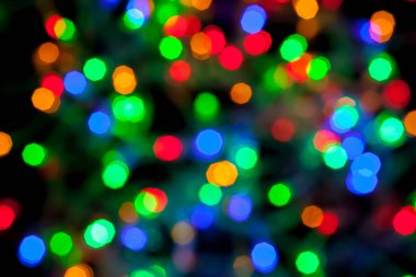 Çok renkli Noel ve yeni yıl ışıklarının bokeh dokusu