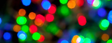 çok renkli Noel ve yeni yıl ışıklarının panorama bokeh dokusu