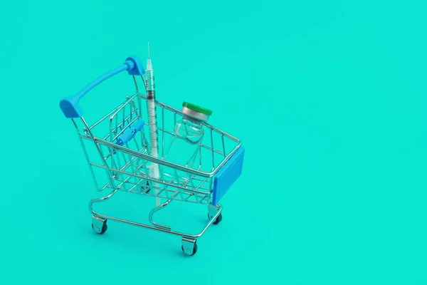 Carrello Supermercato Con Siringhe Fiala Fondo Blu — Foto Stock