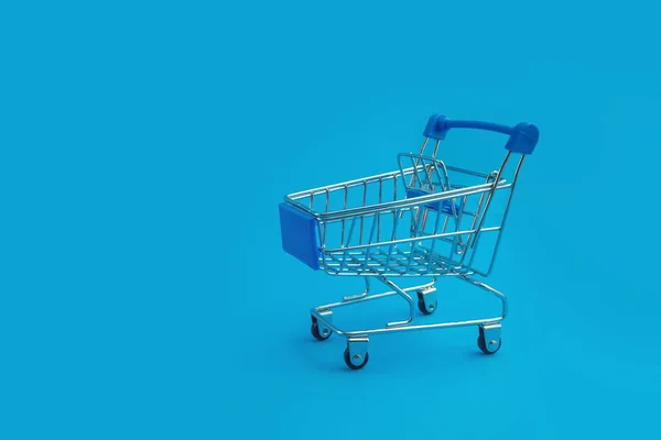 Supermarket Trolley Blue Background — Stock Photo, Image