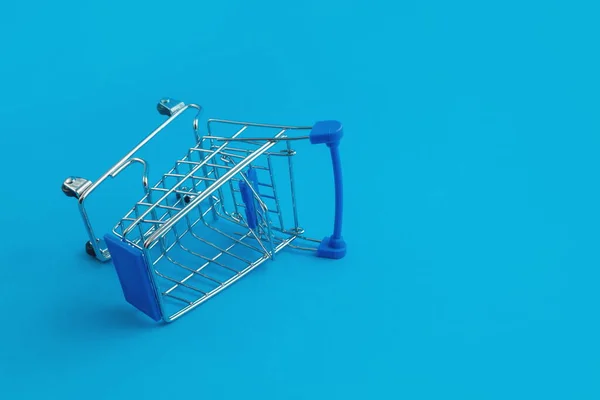 Supermarket Trolley Blue Background — Stock Photo, Image