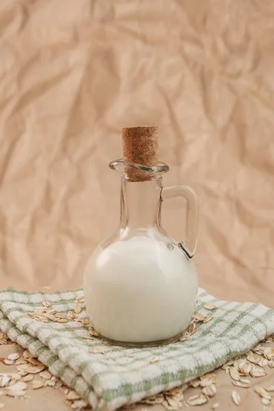 Carafe Milk Scattered Oatmeal Crumpled Paper Background — Stock Photo, Image