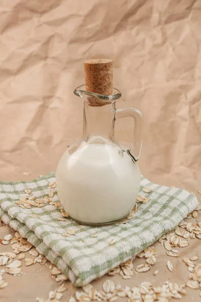 Carafe Milk Scattered Oatmeal Crumpled Paper Background — Stock Photo, Image