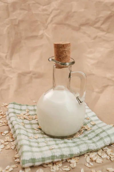 Carafe Milk Scattered Oatmeal Crumpled Paper Background — Stock Photo, Image