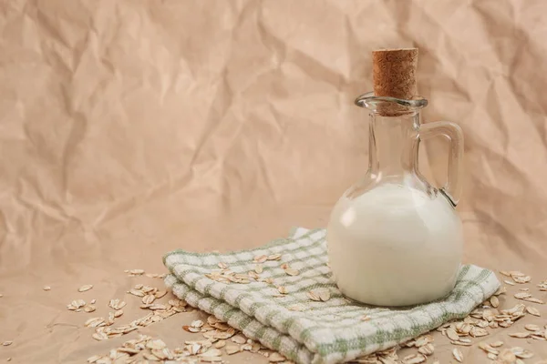 Carafe Milk Scattered Oatmeal Crumpled Paper Background — Stock Photo, Image