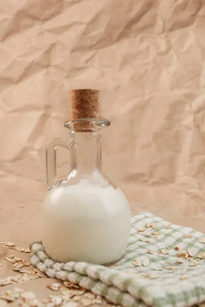 Carafe Milk Scattered Oatmeal Crumpled Paper Background — Stock Photo, Image