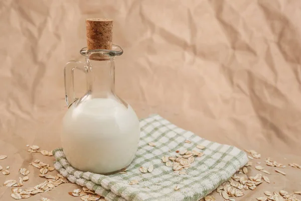 Carafe Milk Scattered Oatmeal Crumpled Paper Background — Stock Photo, Image