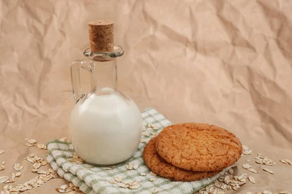 Carafe Milk Oatmeal Cookies Crumpled Paper Background — Stock Photo, Image