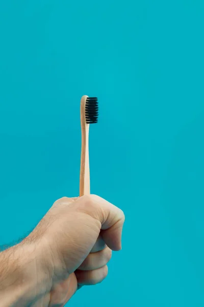 Wooden Toothbrush Hand Blue Background — Stock Photo, Image
