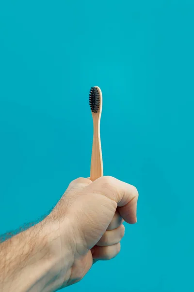 Wooden Toothbrush Hand Blue Background — Stock Photo, Image