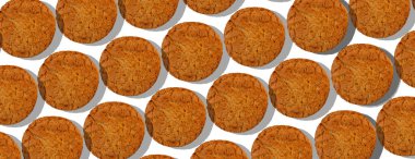 Beyaz arkaplanda yulaf ezmeli kurabiyelerin dokusu