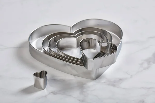 Set Stainless Steel Heart Shaped Cookie Cutters White Marble Surface — Stock Photo, Image