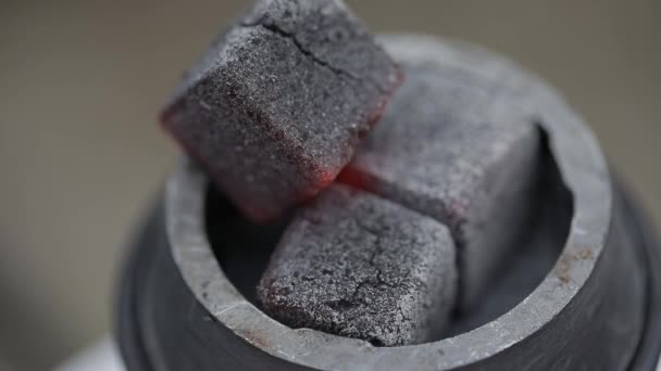 Coals on the bowl of shisha in the arabic cafe.image of traditional hookah hot coals for smoking and leisure in natural lighting, close up, lounge caffee — Stock Video