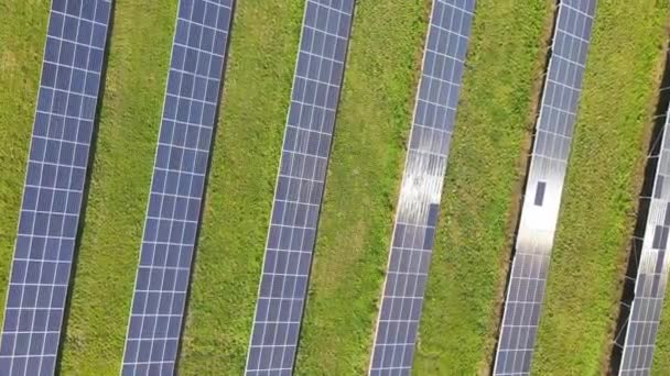 Aerial view of solar power plant, source of ecological renewable energy. Flying over solar panels. — Stock Video