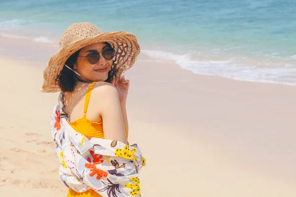 Portrait of happy smiling asian woman on the beach on a beautiful . Pretty girl asian in casual looking away and smile , laughing. The beach beautiful at bright sky
