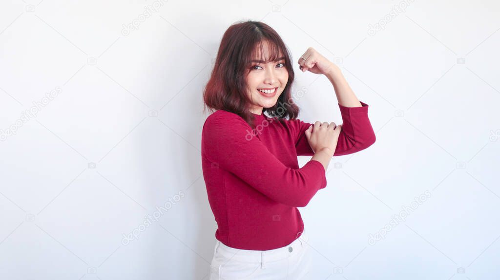 Strong gesture of Asian beautiful girl with red shirt in white background.