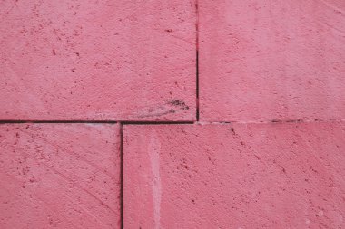 Pembe tuğla bir duvar ya da yola yakın, eski taş desenli arka plan.