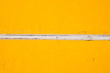 Yumuşak pastel sarı bir duvarı kapat, arka plan olarak kullanılabilir..