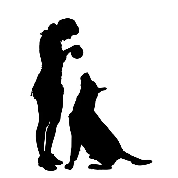 Vector silhouet van een vrouw en de hond. — Stockvector