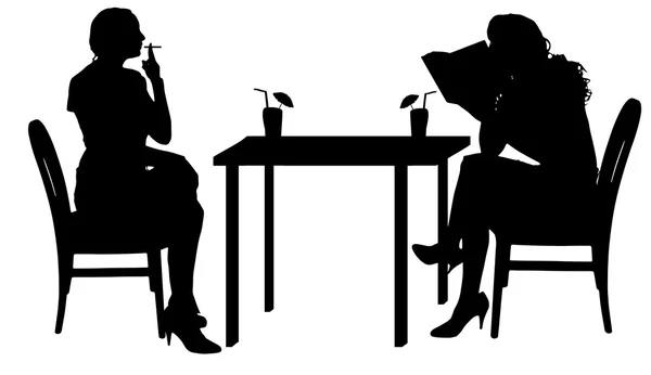 Mujeres sentadas a la mesa . — Vector de stock