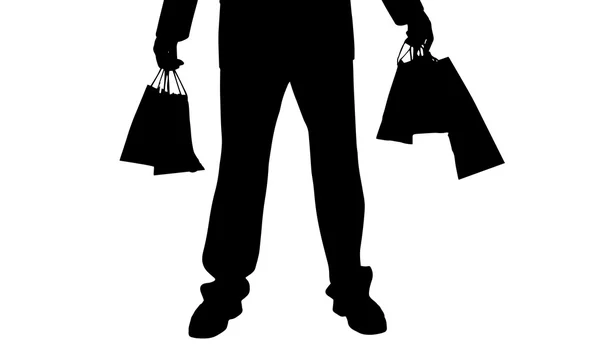 Homem com um saco de compras . — Vetor de Stock