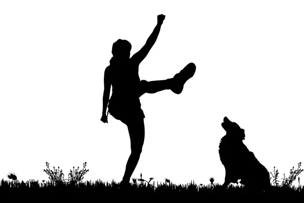 Silhouette d'une femme avec un chien . — Image vectorielle