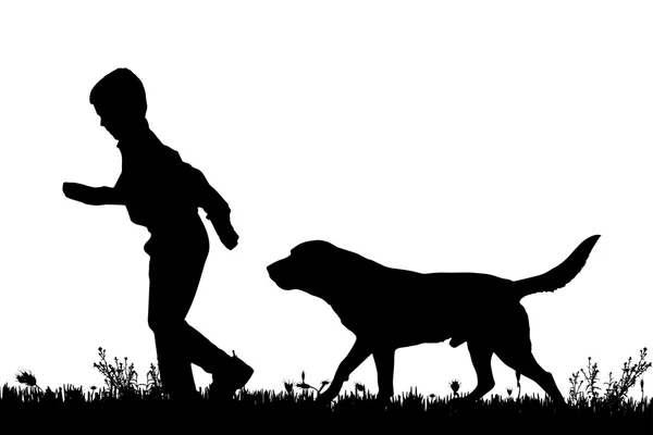 Silhouet van een kind met een hond. — Stockvector