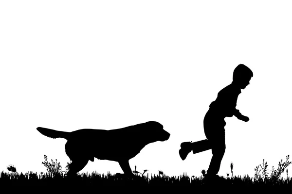Silhueta de uma criança com um cão . —  Vetores de Stock