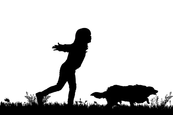 Silueta de un niño con un perro . — Vector de stock