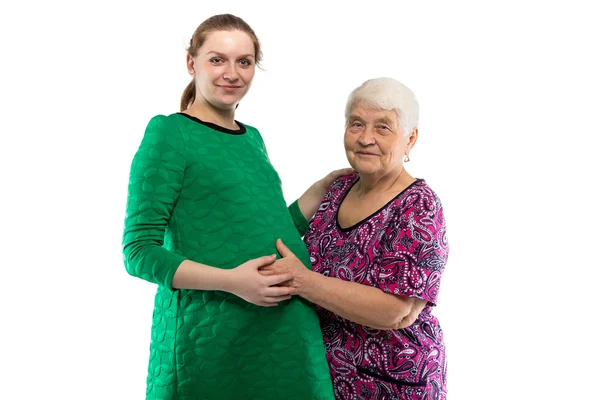 Usmíval se babička dotýká břicho vnučky — Stock fotografie