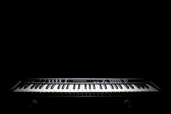 Piano in shadow — Stock Photo, Image