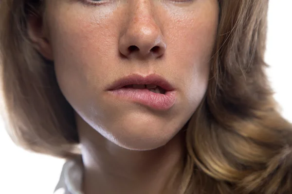 Woman biting her lip — Stock Photo, Image