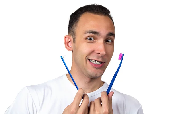 Brünette Mann mit Zahnbürsten — Stockfoto
